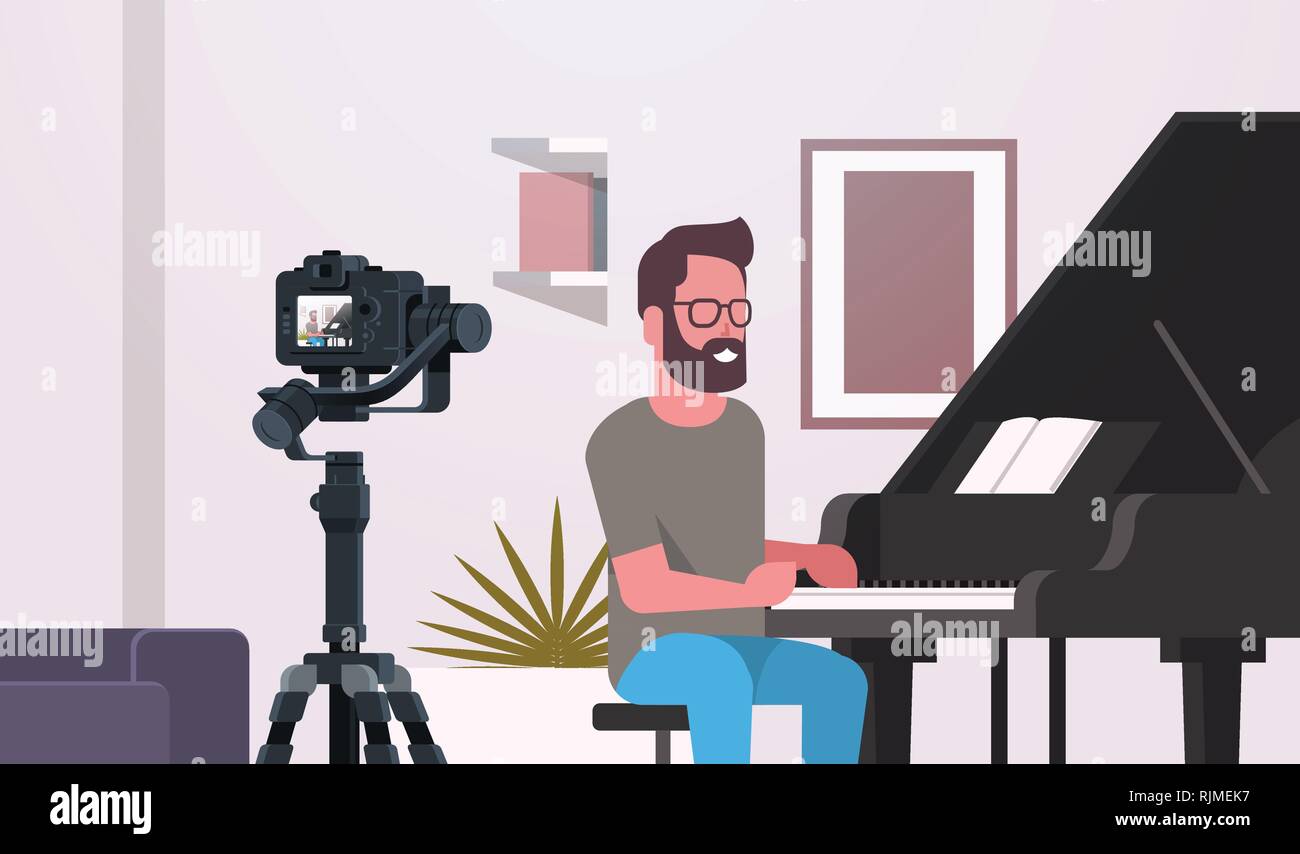 Guy blogger musical grabación de vídeo en la cámara hombre tocando el piano  clásico música blog concepto moderno apartamento closeup horizontal  interior Imagen Vector de stock - Alamy