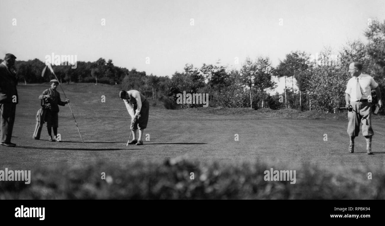 Italia, Veneto, jugando al golf, 1930 Foto de stock