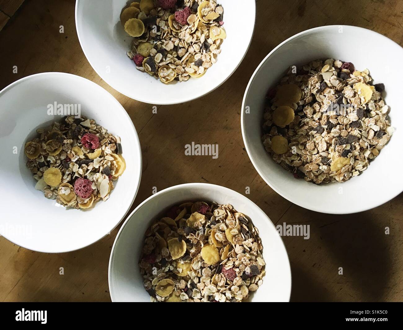Cuatro bowles con muesli cereales Foto de stock