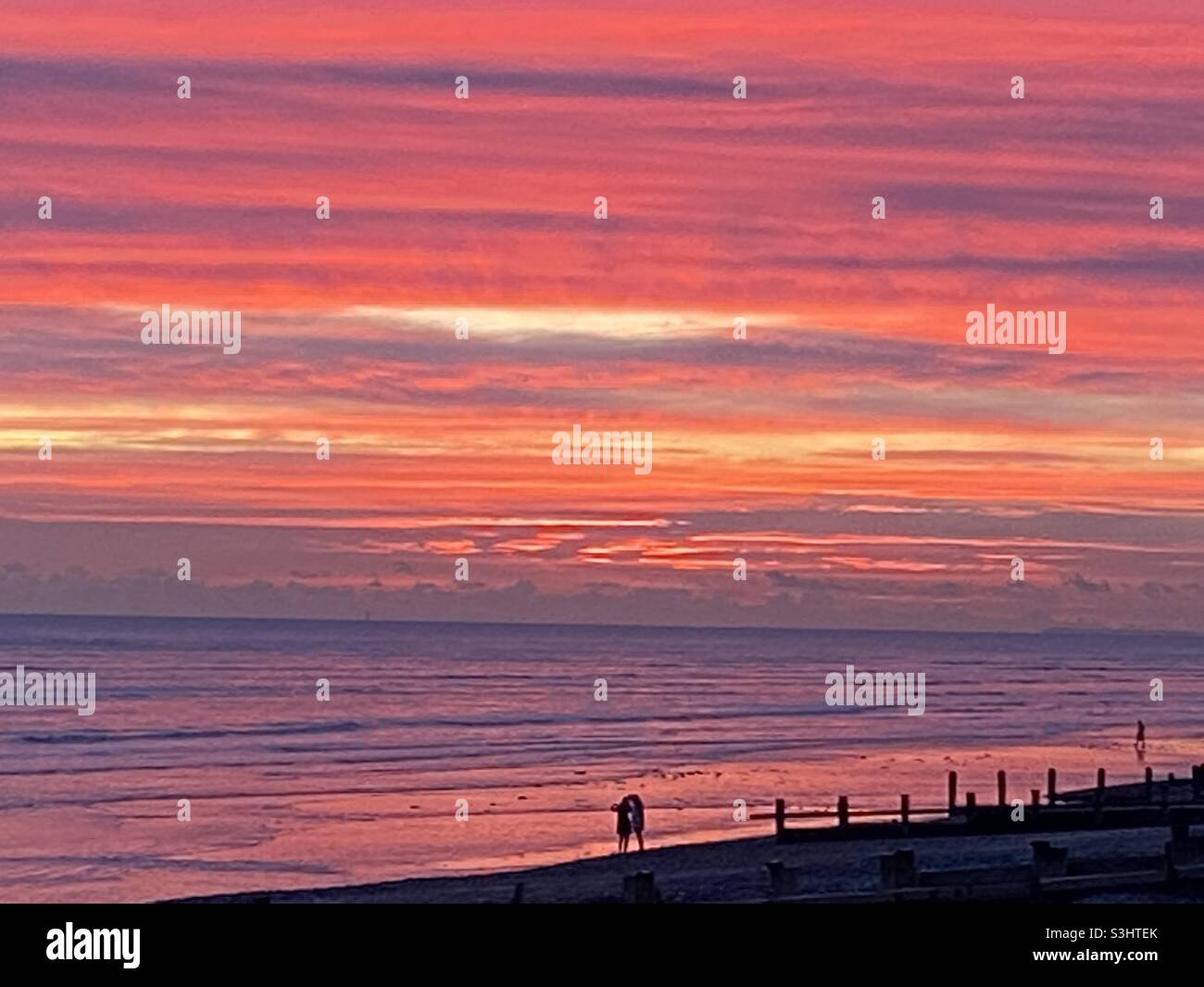 La puesta de sol de Worthing Beach Foto de stock