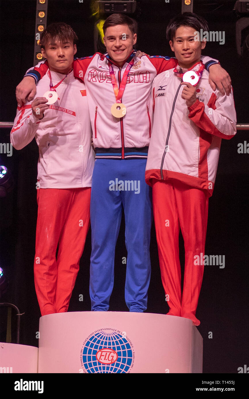 Birmingham, Inglaterra, Reino Unido. 23 Mar, 2019. La China Wei Sun (plata), la Federación de Rusia la Nikita Nagornyy (oro) y la japonesa Kazuma Kaya (bronce) durante la ceremonia de entrega de medallas de hombres, durante la Copa del Mundo de gimnasia de 2019, en el Resorts World Arena, Birmingham. Crédito: Iain McGuinness/Alamy Live News Foto de stock