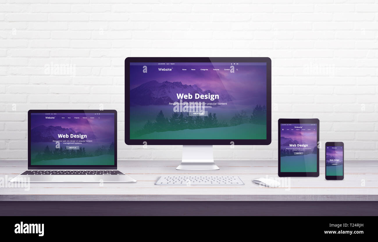 Web design studio concepto con diseño plano receptivo sitio web en  dispositivos de visualización. Escritorio de oficina con pared de ladrillos  en el fondo Fotografía de stock - Alamy