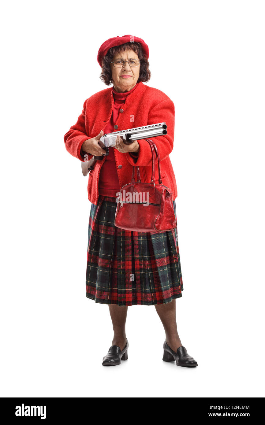 Longitud total retrato de una mujer mayor gruñón con una escopeta aislado sobre fondo blanco. Foto de stock