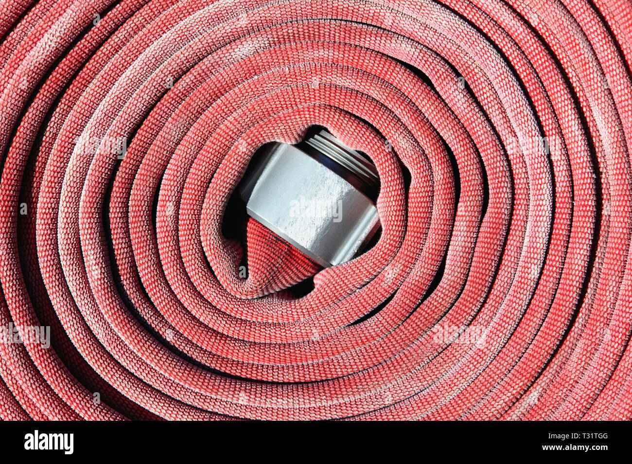 Enrollado de manguera contra incendios Fotografía de stock - Alamy