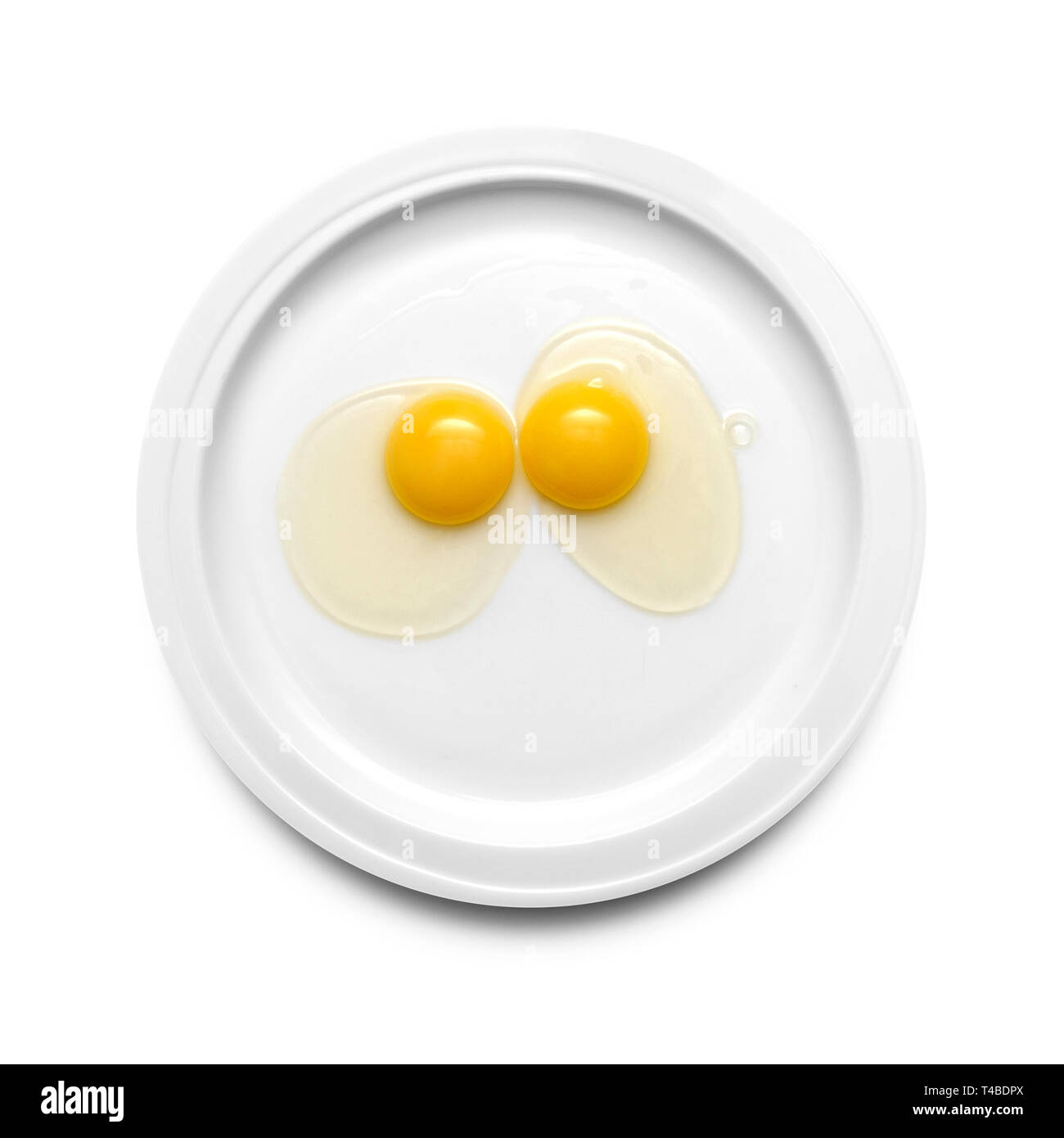 Dos yemas de huevo de gallina en una placa Foto de stock
