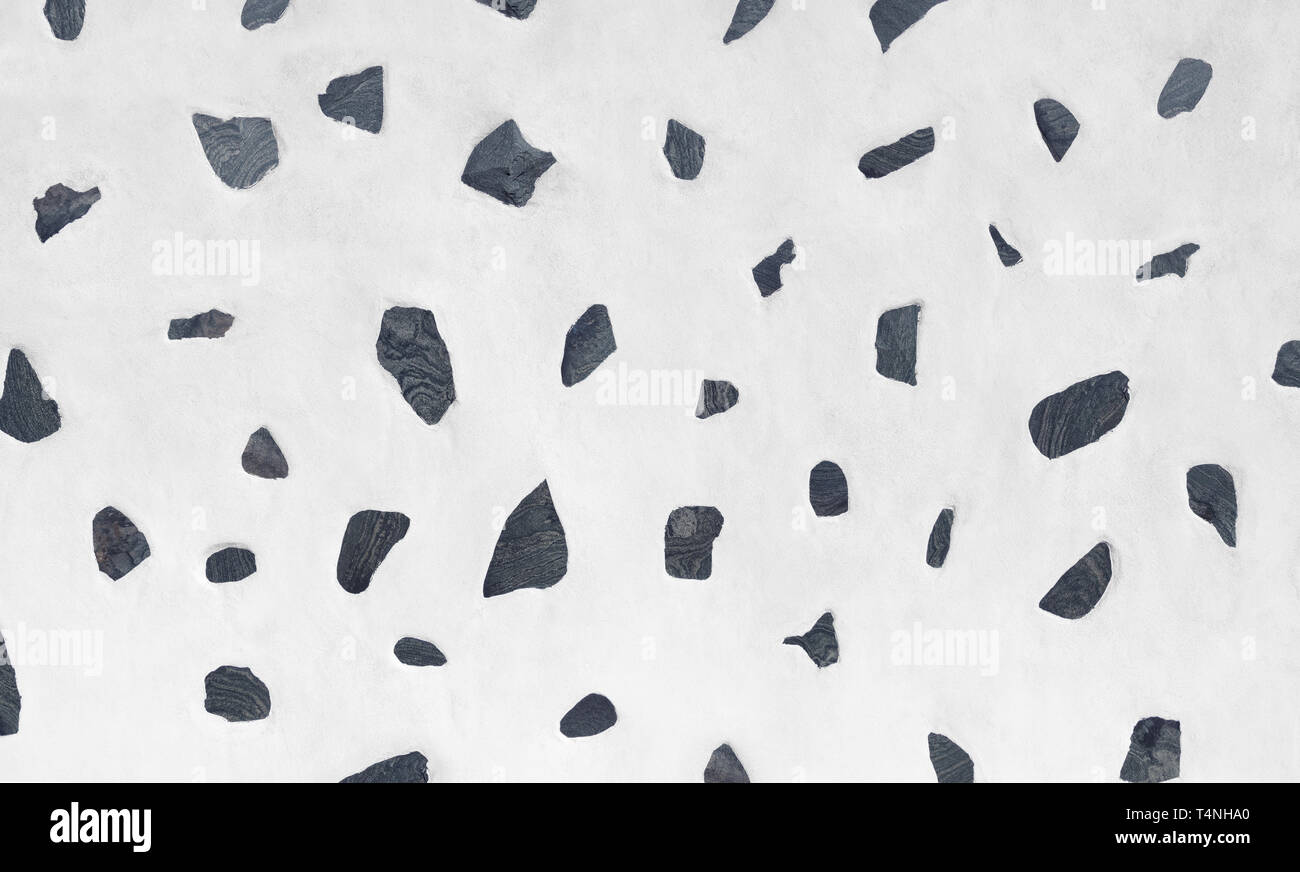Pared Blanca con patrón de piedras de lava gris Foto de stock