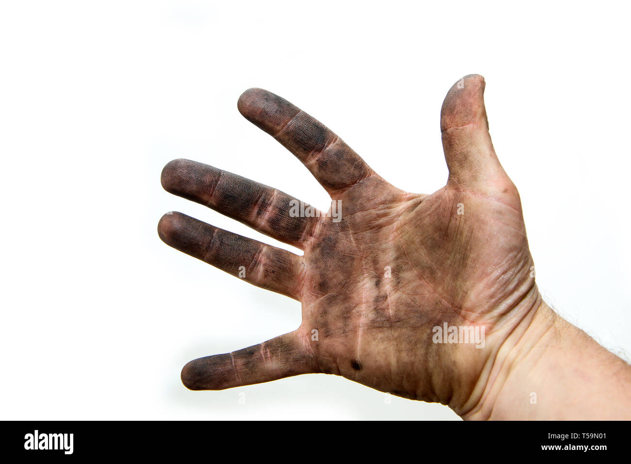 Una imagen de las manos sucias de un hombre, sucio por el petróleo y la vaselina. Aislado sobre un fondo blanco. Foto de stock