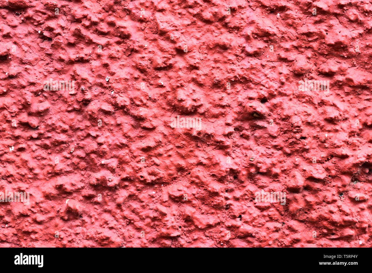 Textura granular roja de pared la textura de la superficie granulada. Foto de stock