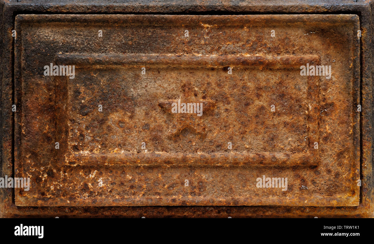 Fondos y texturas: muy antiguo de hierro fundido oxidado panel con forma de estrella de socorro Foto de stock