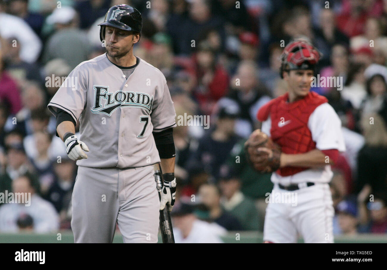 Boston Red Sox's Jason Varitek, right, pats Jed Lowrie, second from right,  after Lowrie's grand slam that brought home Varitek, George Kottaras,  second from left, and Joey Gathright, behind center, in the