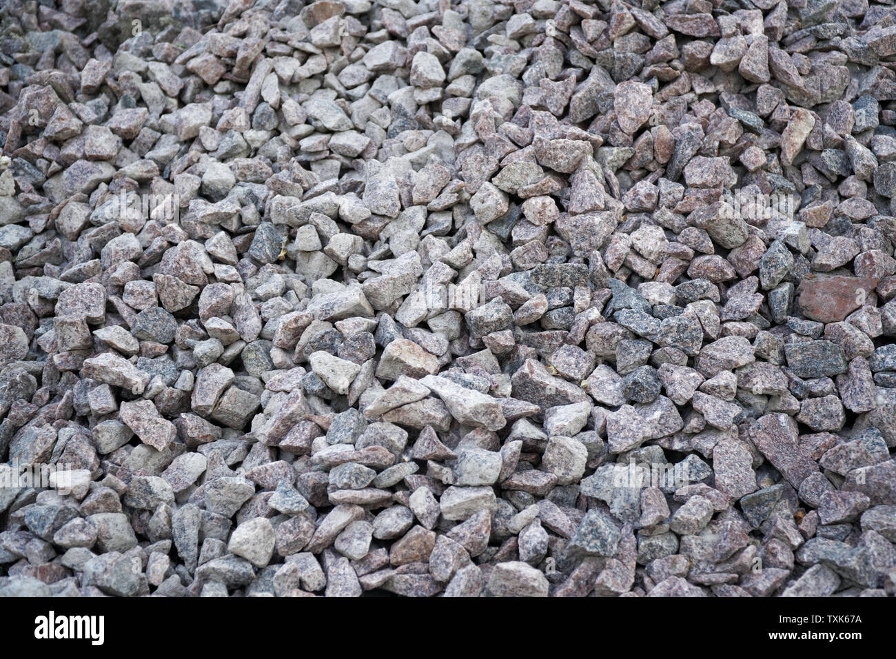 Carretera de grava y gravilla de granito de textura. Fondo de grava  triturada. Montón de piedras de textura. Carbones industriales Fotografía  de stock - Alamy