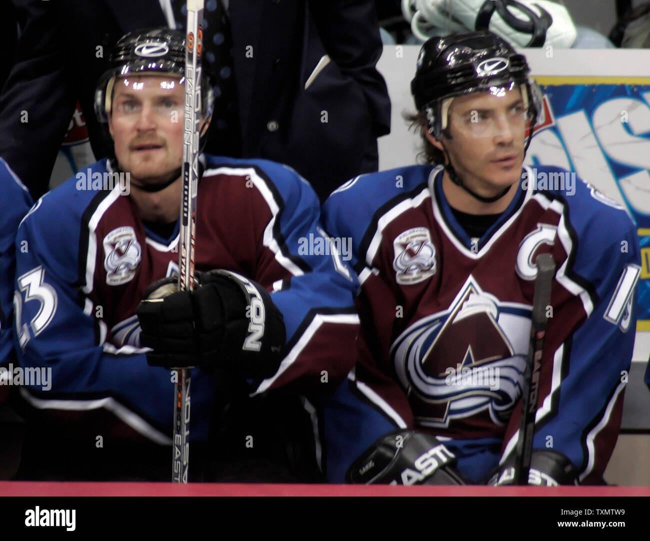 L-R) Colorado Avalanche players Milan Hejduk, John-Michael Liles, Curtis  Leschyshyn, and head coach Joel Quenneville model four generations of NHL Avalanche  jerseys at the Pepsi Center in Denver on September 12, 2007.
