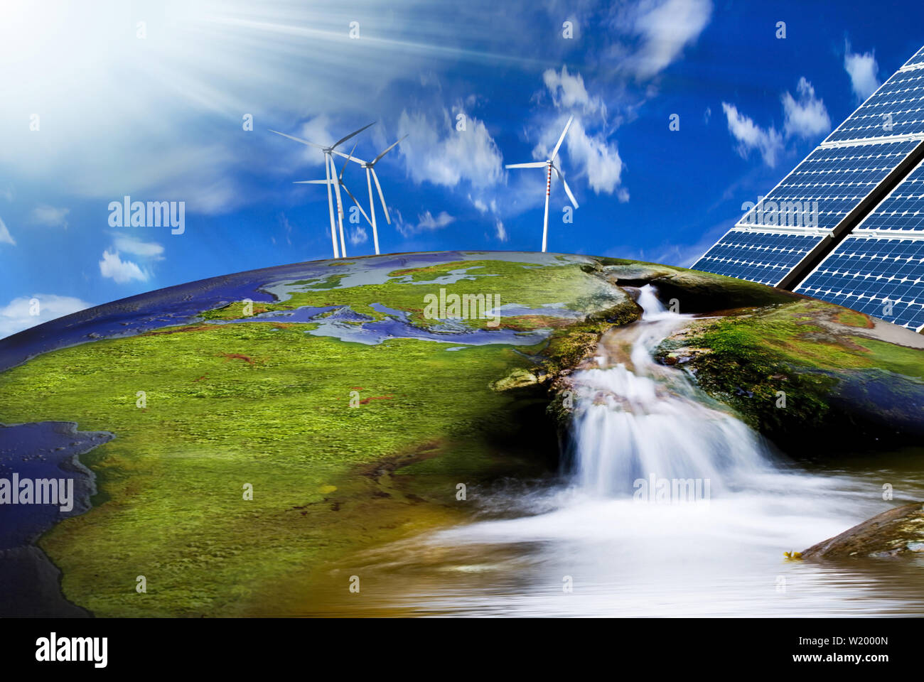 Turbinas de viento y paneles solares en la imagen de la Tierra en un contexto de energía limpia Foto de stock