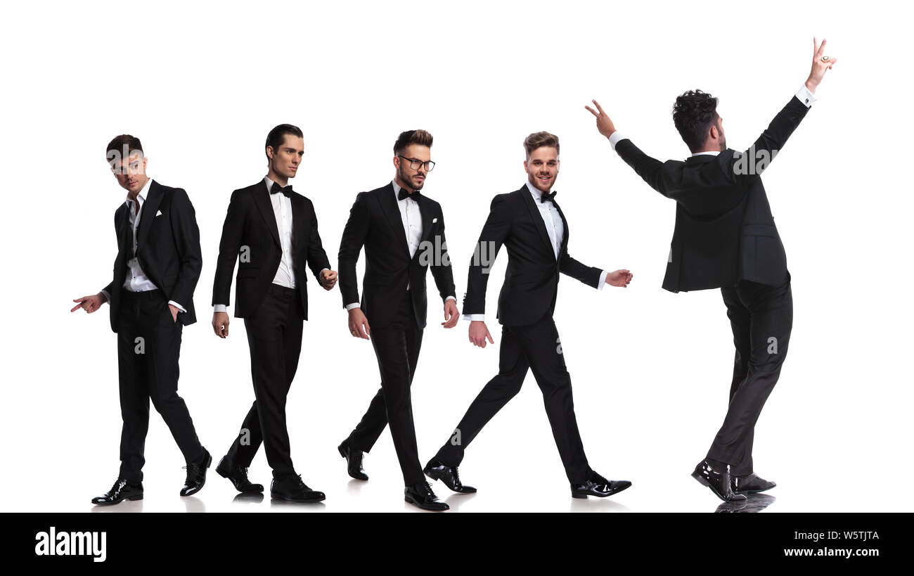 Cinco hombres vestidos elegantes tuxedoes caminando en direcciones  diferentes y una celebración con las manos en el aire, sobre fondo blanco  Fotografía de stock - Alamy