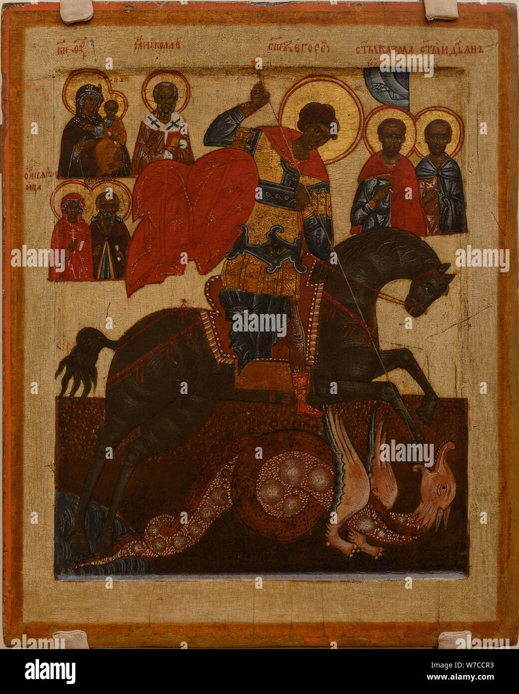Saint George con algunos santos. Foto de stock