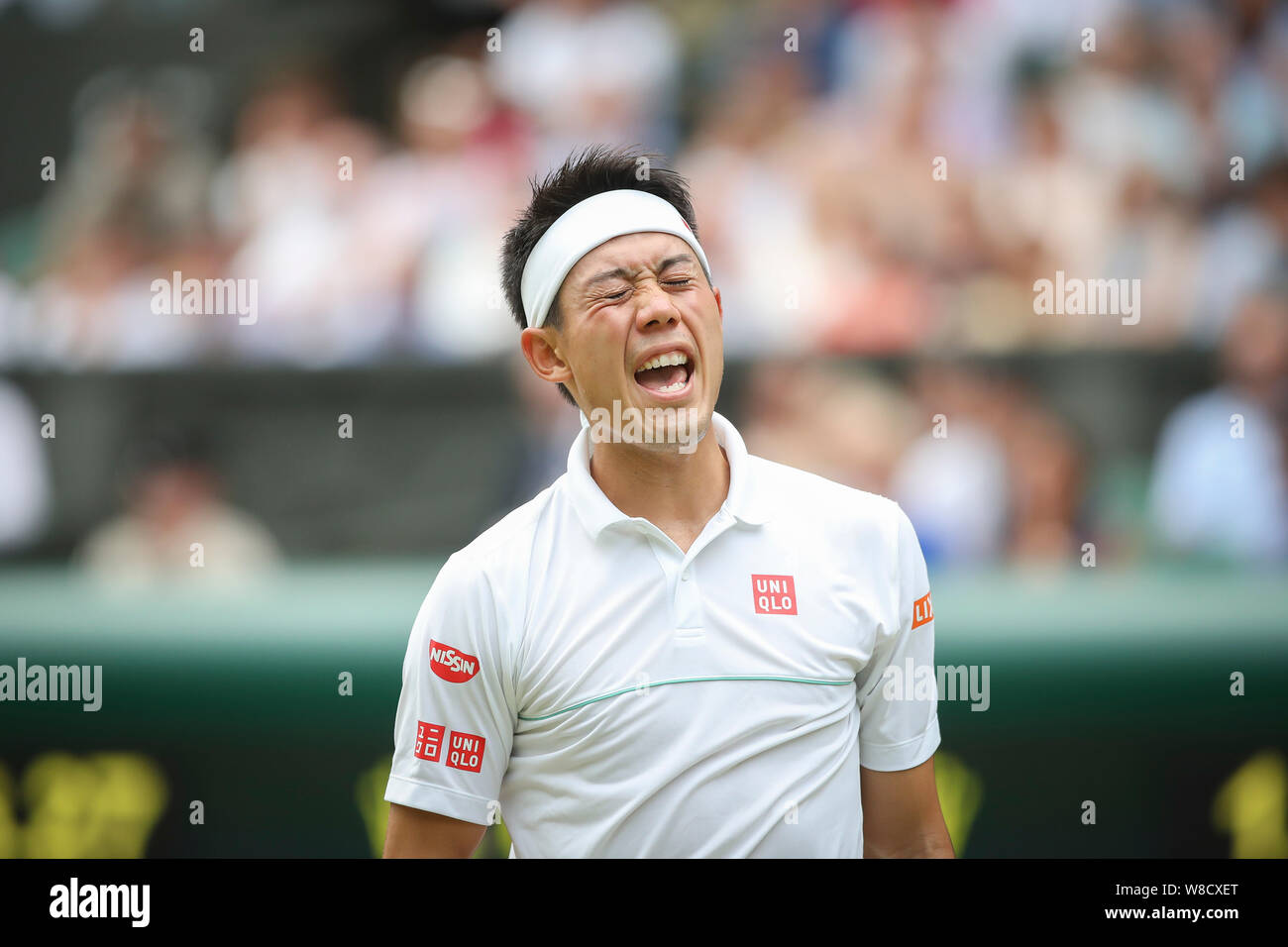 Tenista japonés Kei Nishikori expresando su decepción durante 2019 campeonatos de Wimbledon, Londres, Inglaterra, Reino Unido Foto de stock