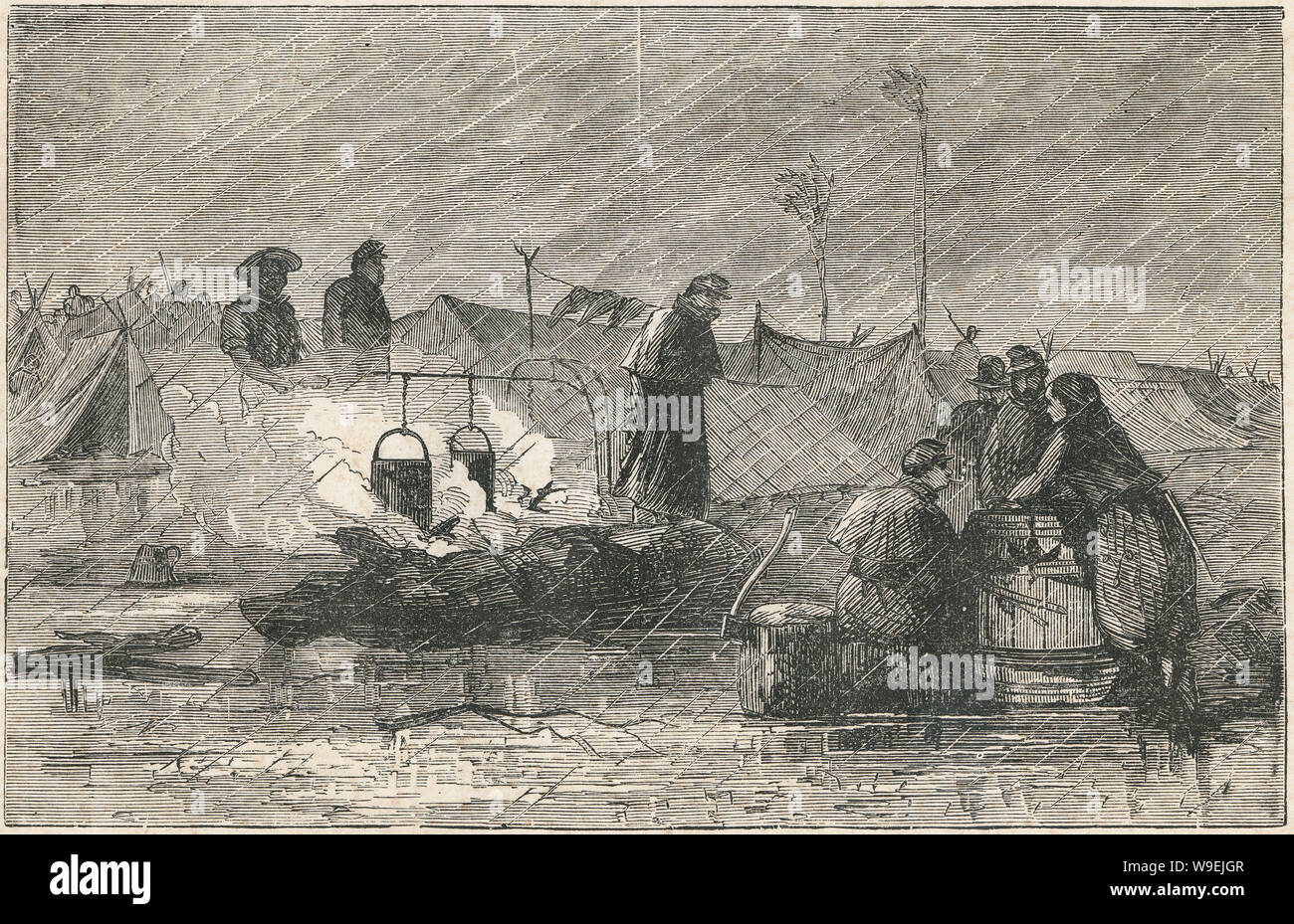 Antiguo grabado de 1873, "la vida del campamento" mostrando una unión de los soldados de la Guerra Civil americana en la lluvia. Fuente: Grabado original Foto de stock
