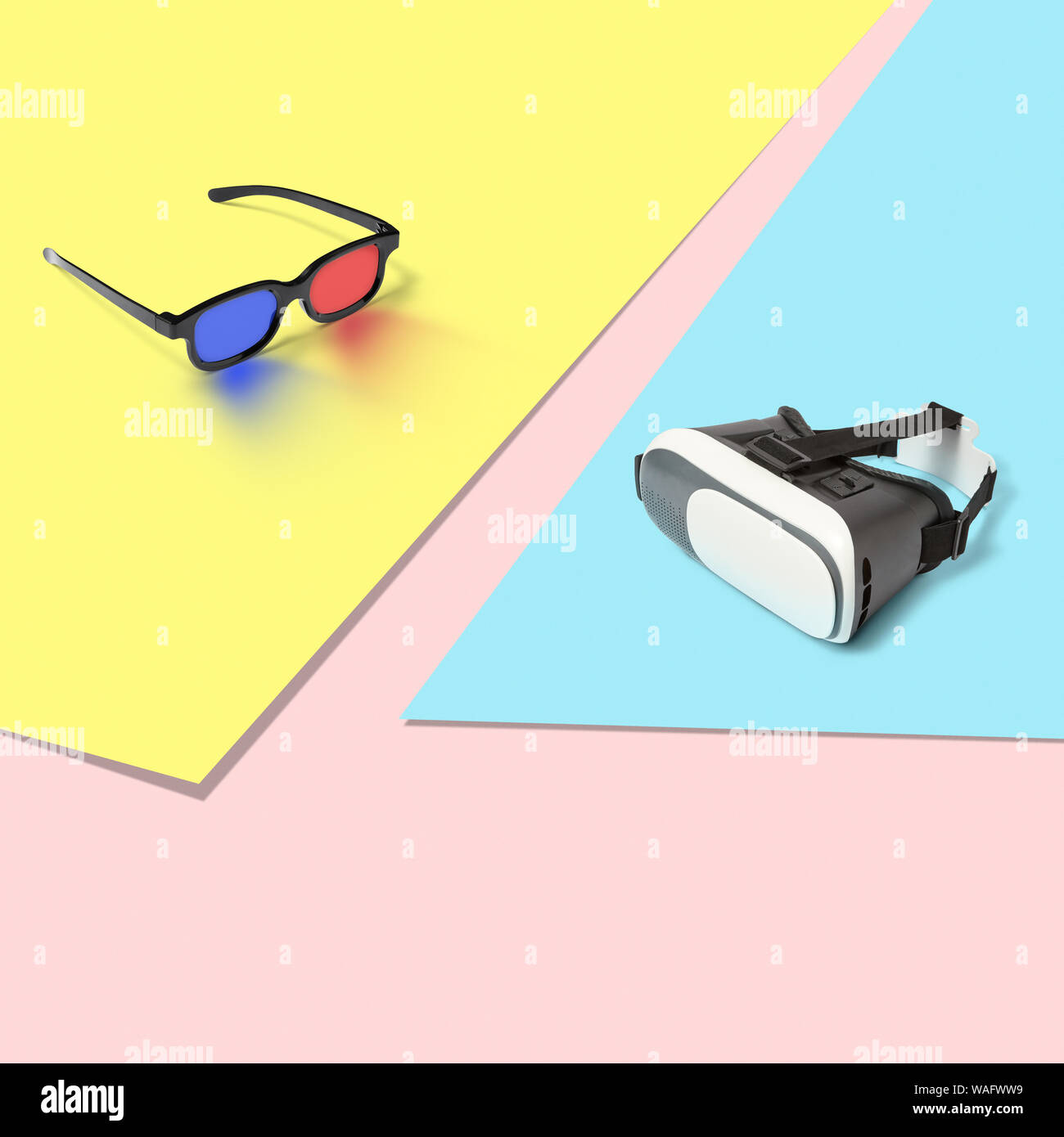 Plástico gafas estéreo 3d para ver películas y la realidad virtual VR gafas  para jugar a juegos de ordenador sobre un fondo de pastel tricolor con  copia spac Fotografía de stock -