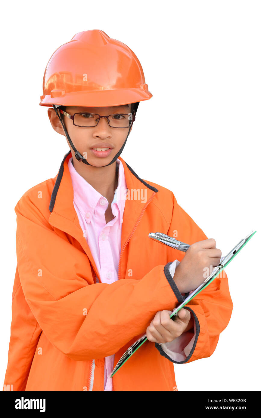 Retrato de niño en ropa de trabajo protectora de pie contra el fondo blanco. Foto de stock