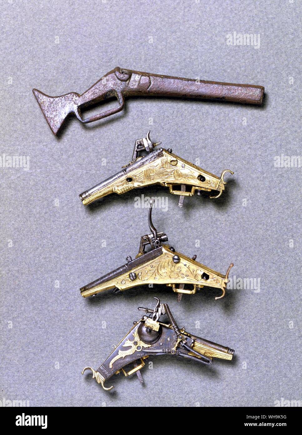 Armas antiguas wheellocks 1025-1870 tres miniatura Foto de stock