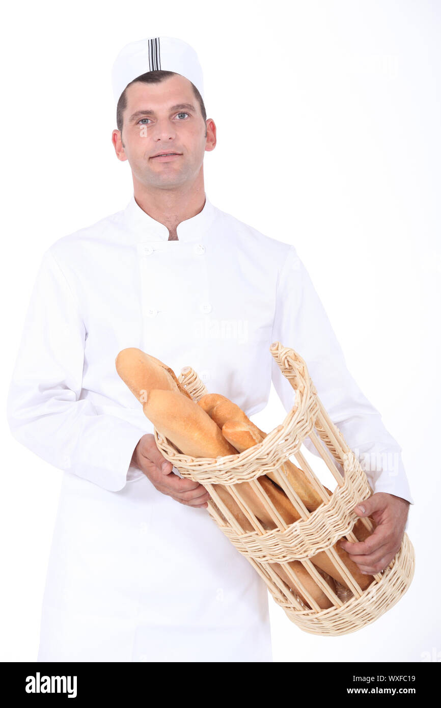 Baker con cesta de pan Foto de stock