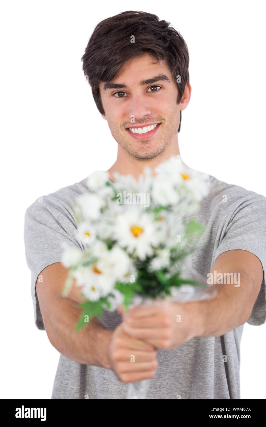 Hombre Joven Que Lleva Un Montón De Regalos, Aislado En Blanco Fotos,  retratos, imágenes y fotografía de archivo libres de derecho. Image 65253746