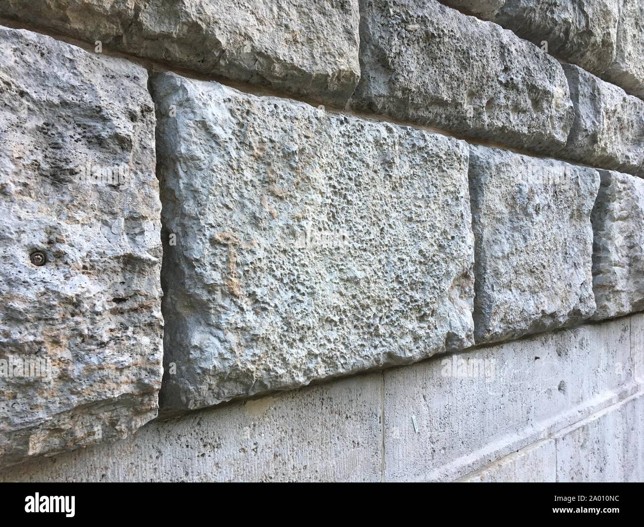 Couleur gris/brun Texture mur de pierre avec de grandes briques sur ancien bâtiment historique Banque D'Images