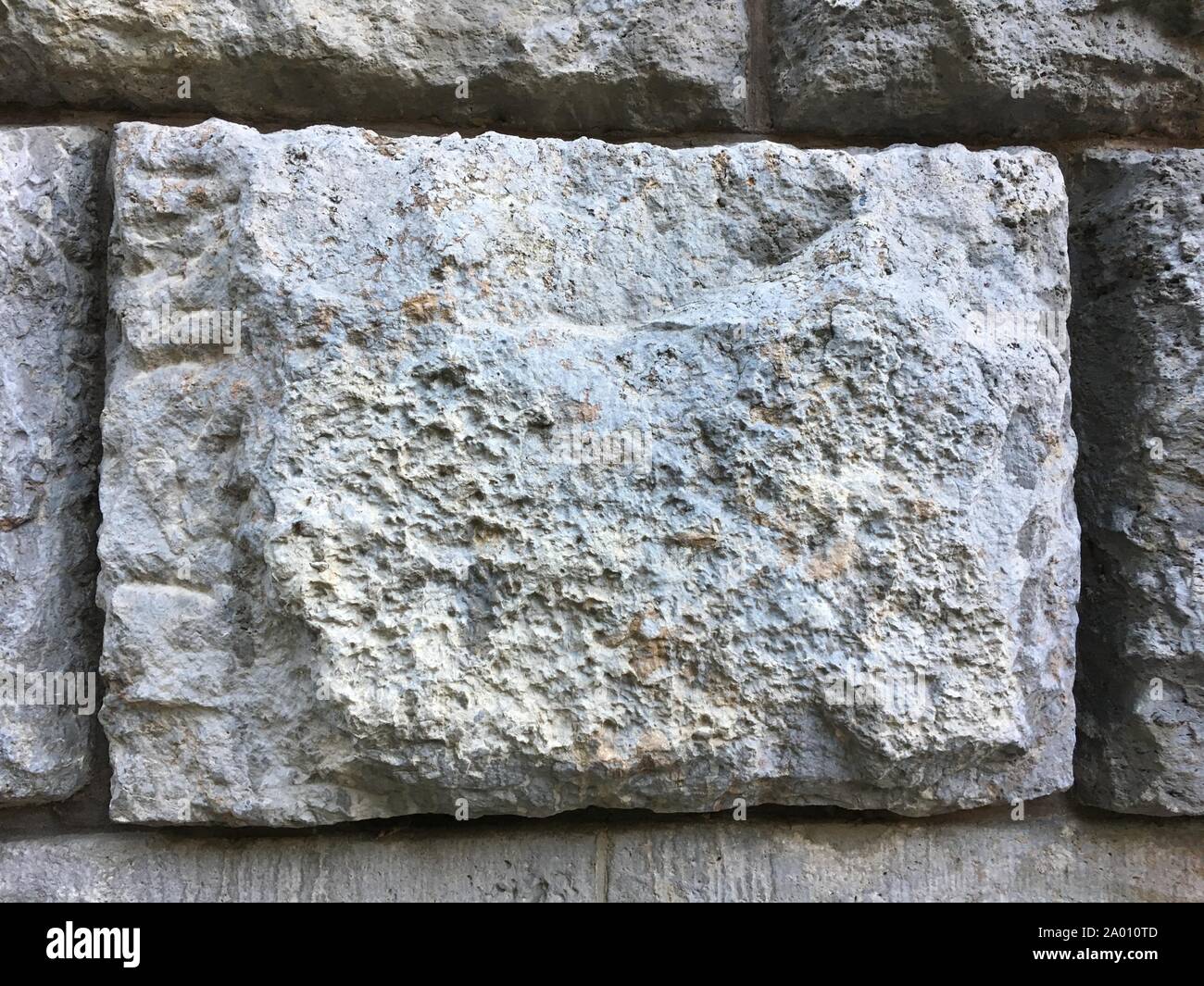 Gros gris brique de mur de pierre modèle sur d'anciens bâtiment historique Banque D'Images