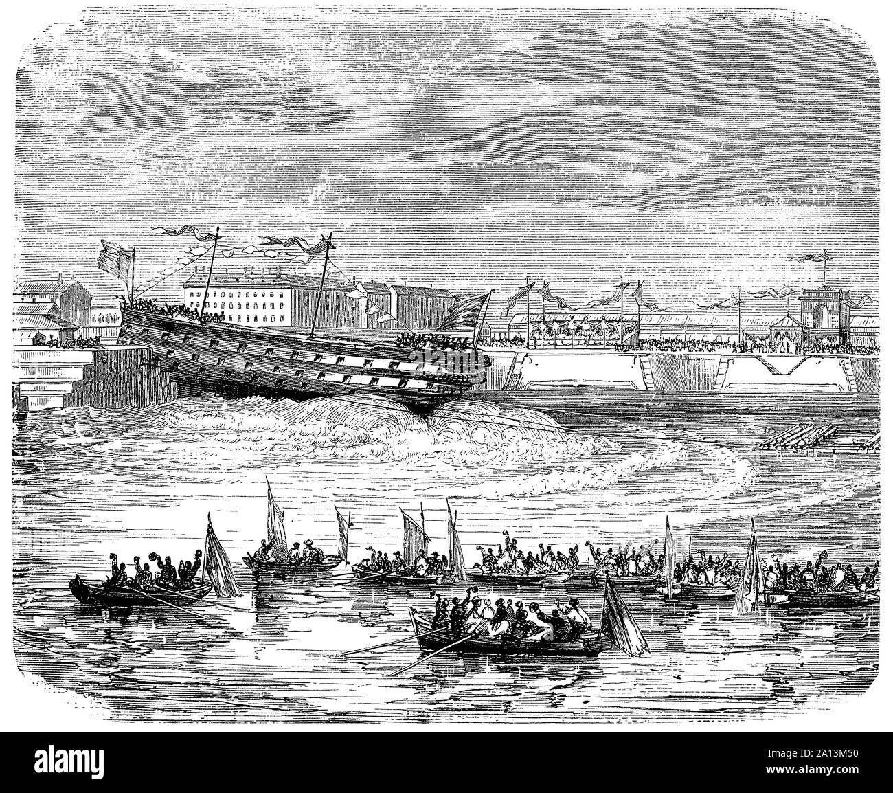 L'homme de guerre navire est lancé en glissant sur une rampe inclinée et entre dans l'eau en travers Banque D'Images