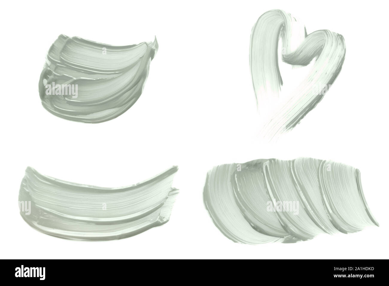 Ensemble de coups de pinceau abstrait tranquille aux tons de couleur vert menthe isolé sur blanc. Banque D'Images