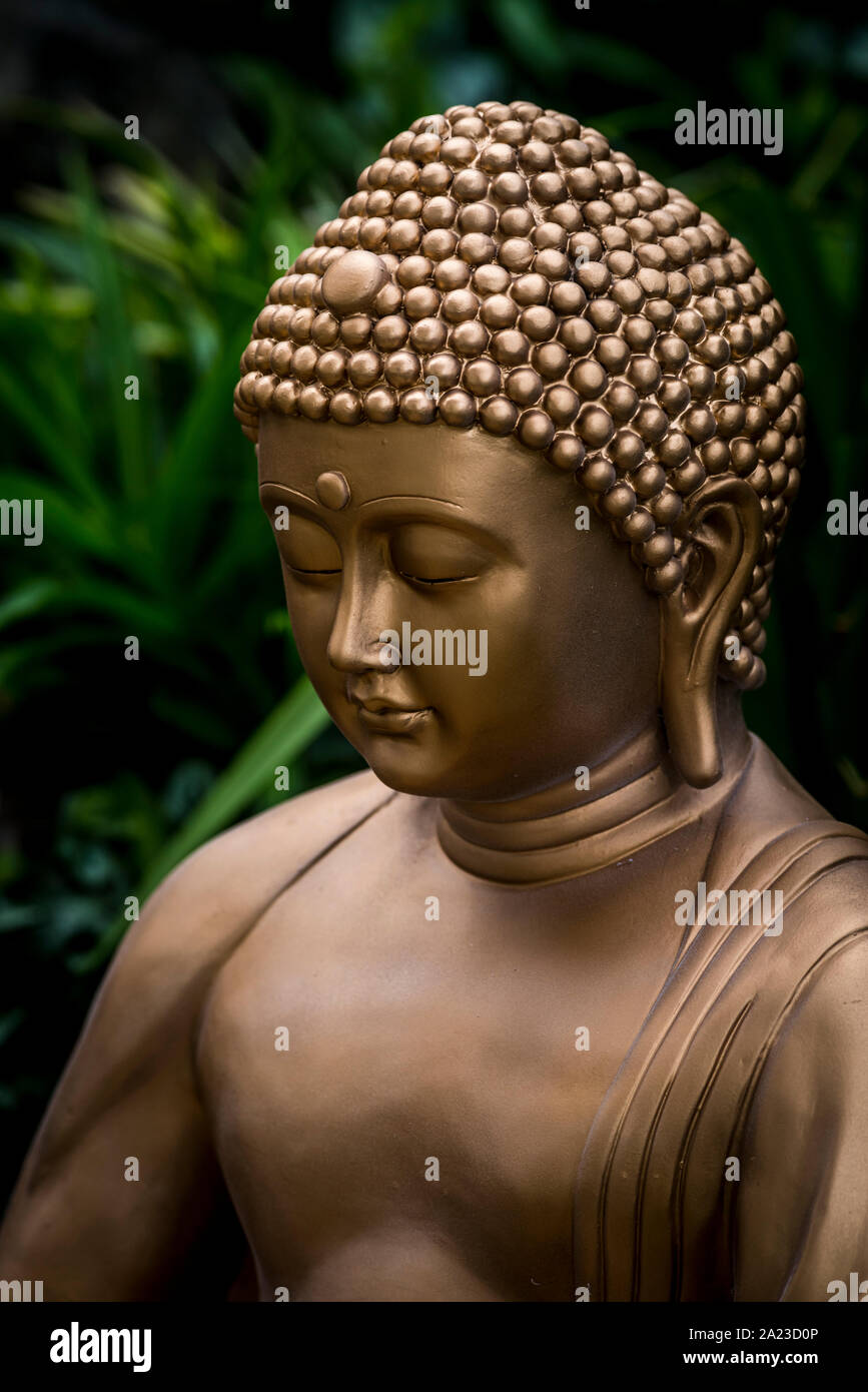 Golden buddha face close up Banque D'Images
