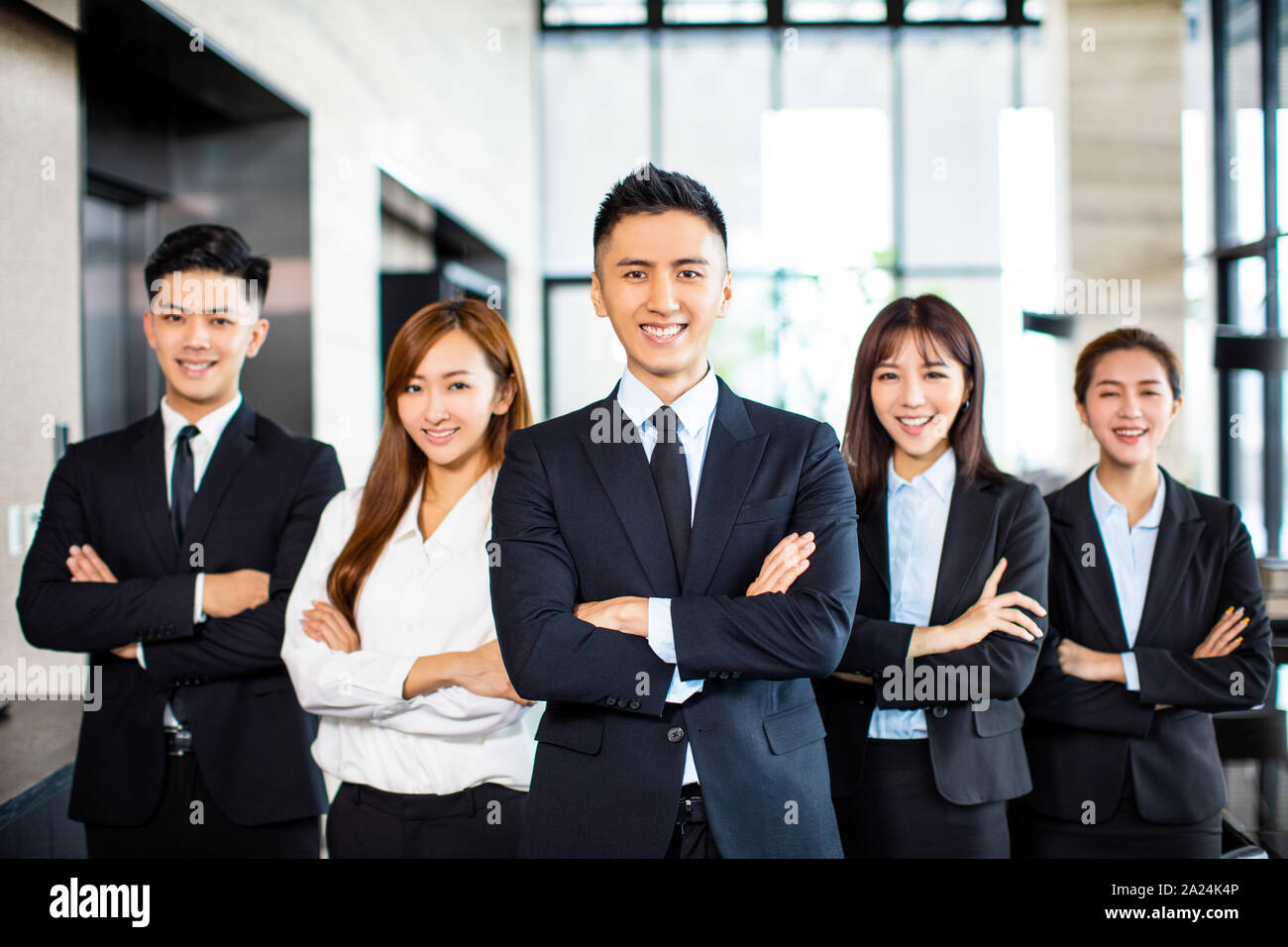 Asian Business Team se tient au pouvoir Banque D'Images