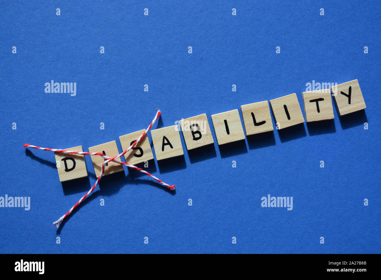 L'invalidité en 3d, avec des lettres en bois Dis barré, laissant le mot Capacité Banque D'Images