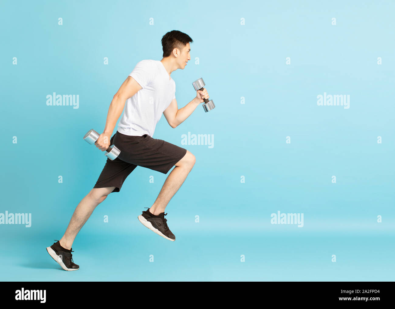 Full Length portrait of young man running fitness Banque D'Images