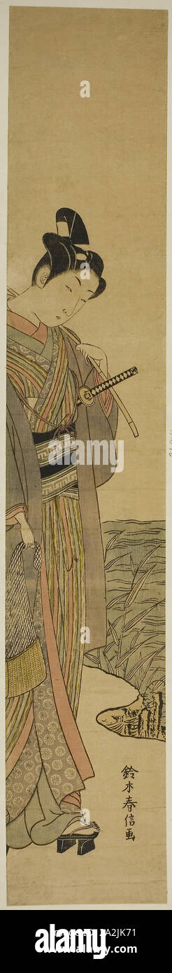 Jeune homme à la canne à pêche et net, c. 1769, Suzuki Harunobu 鈴木 春信, japonais, 1725 ( ?)-1770, le Japon, l'estampe Couleur, hashira-e, 26 1/2 x 4 5/8 po Banque D'Images