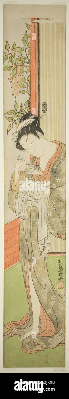 Jeune femme nourrissant un rat, c. 1771, Isoda Koryusai, Japonais, 1735-1790, le Japon, la couleur d'impression sur bois, hashira-e Banque D'Images