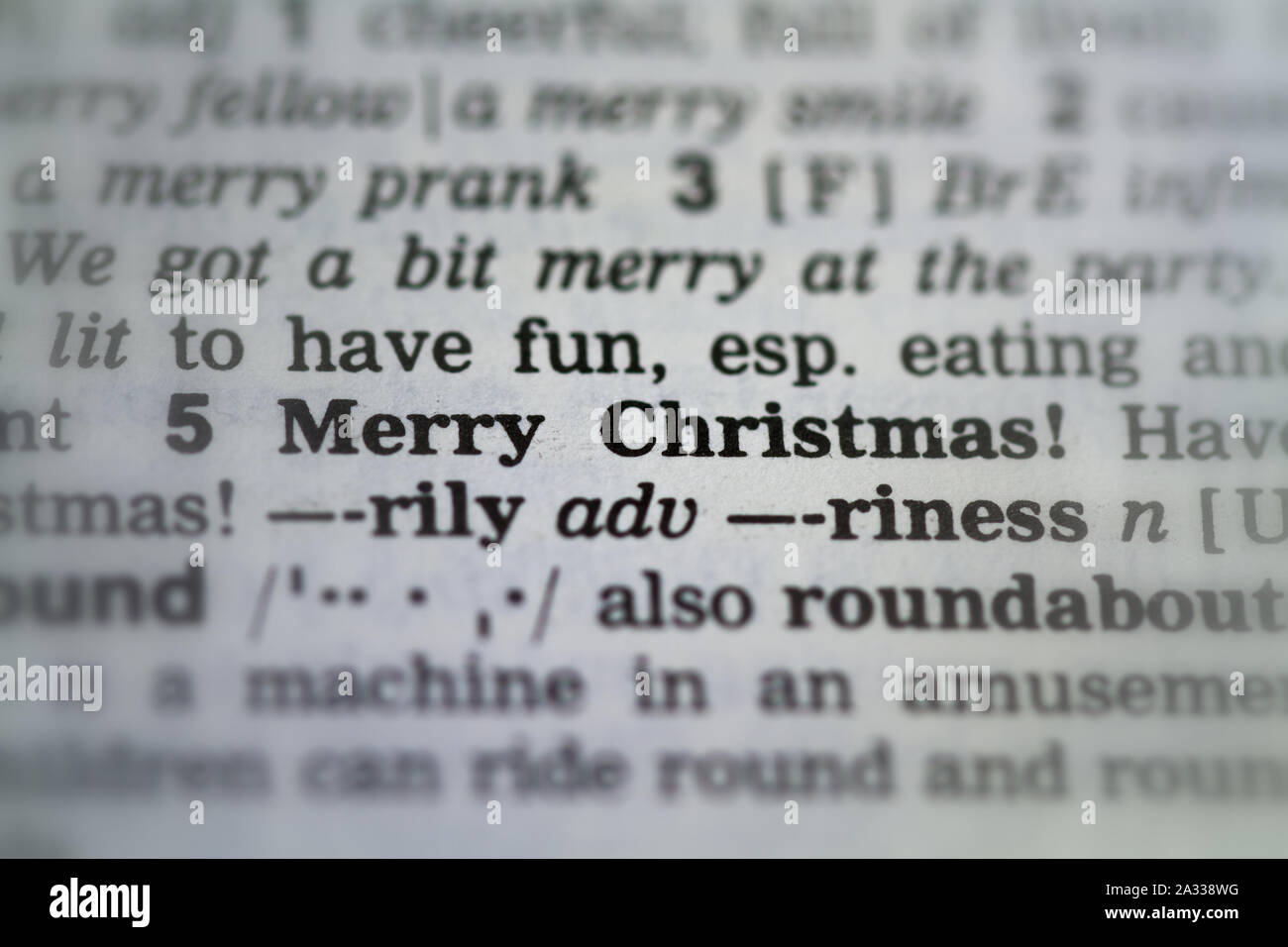 Le mot joyeux Noël définition dans le dictionnaire vieux sous la loupe Banque D'Images