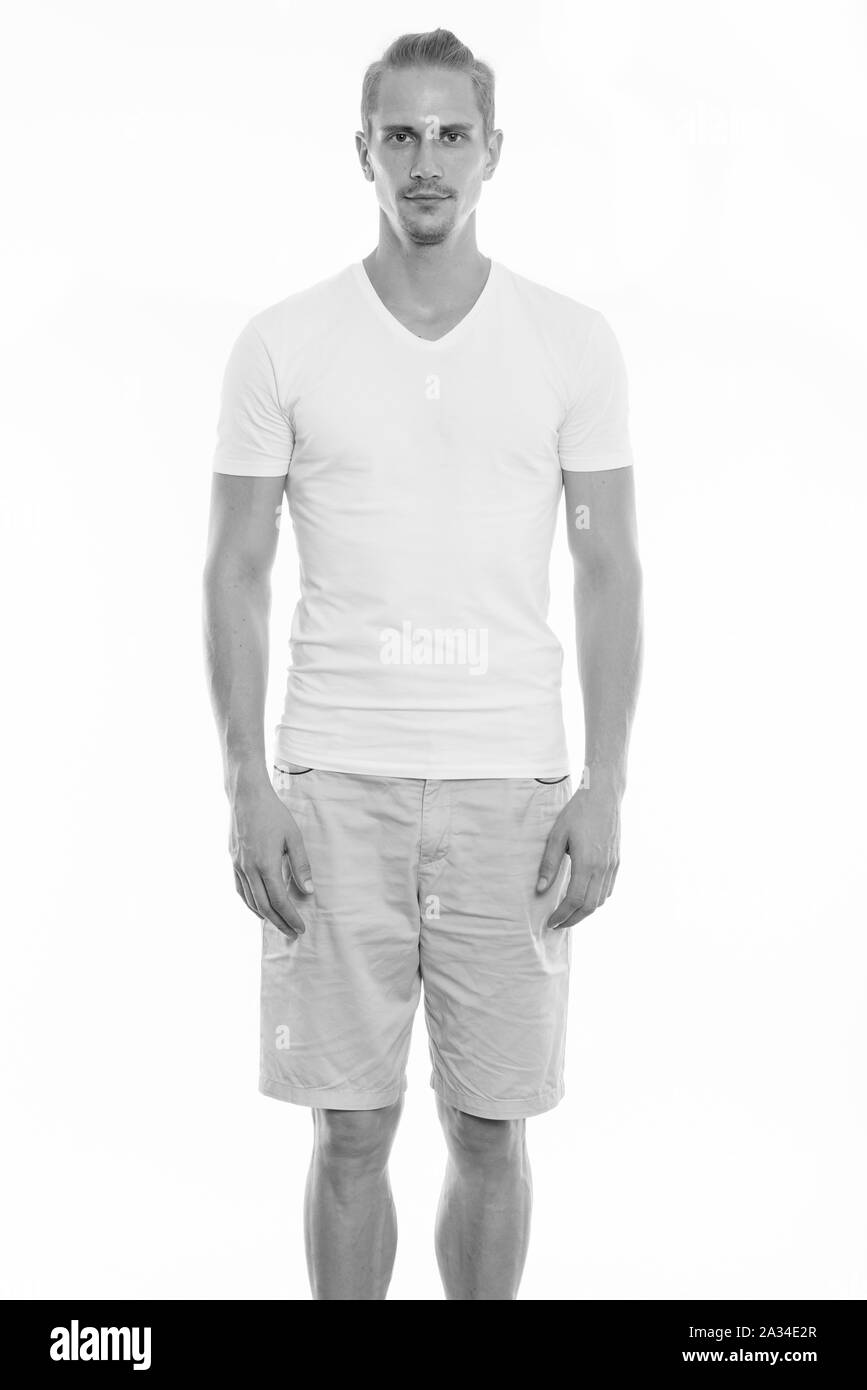 Studio shot of young handsome man standing Banque D'Images Studio shot of young handsome man standing Banque D'Images