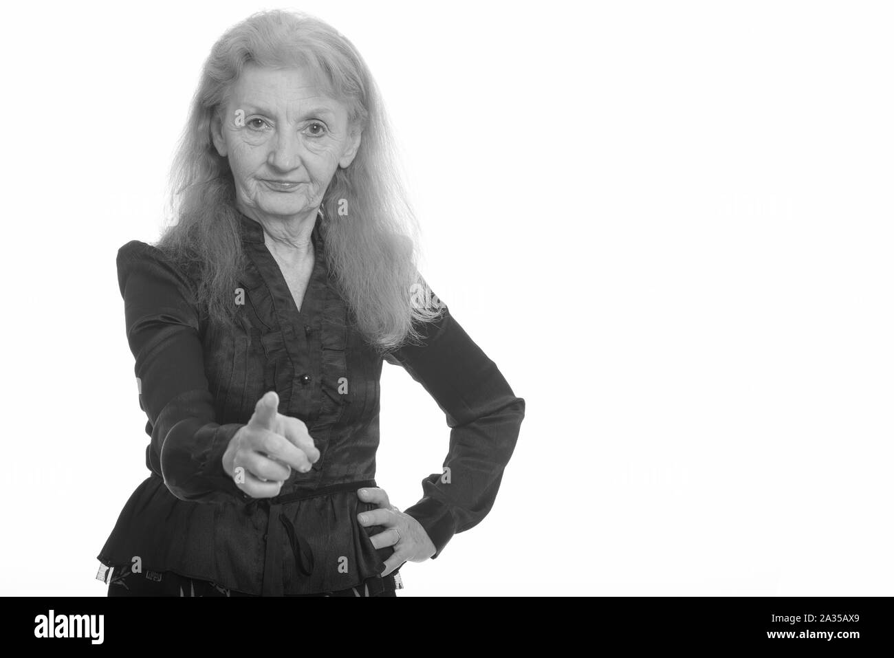 Studio shot of senior businesswoman pointing finger at camera Banque D'Images
