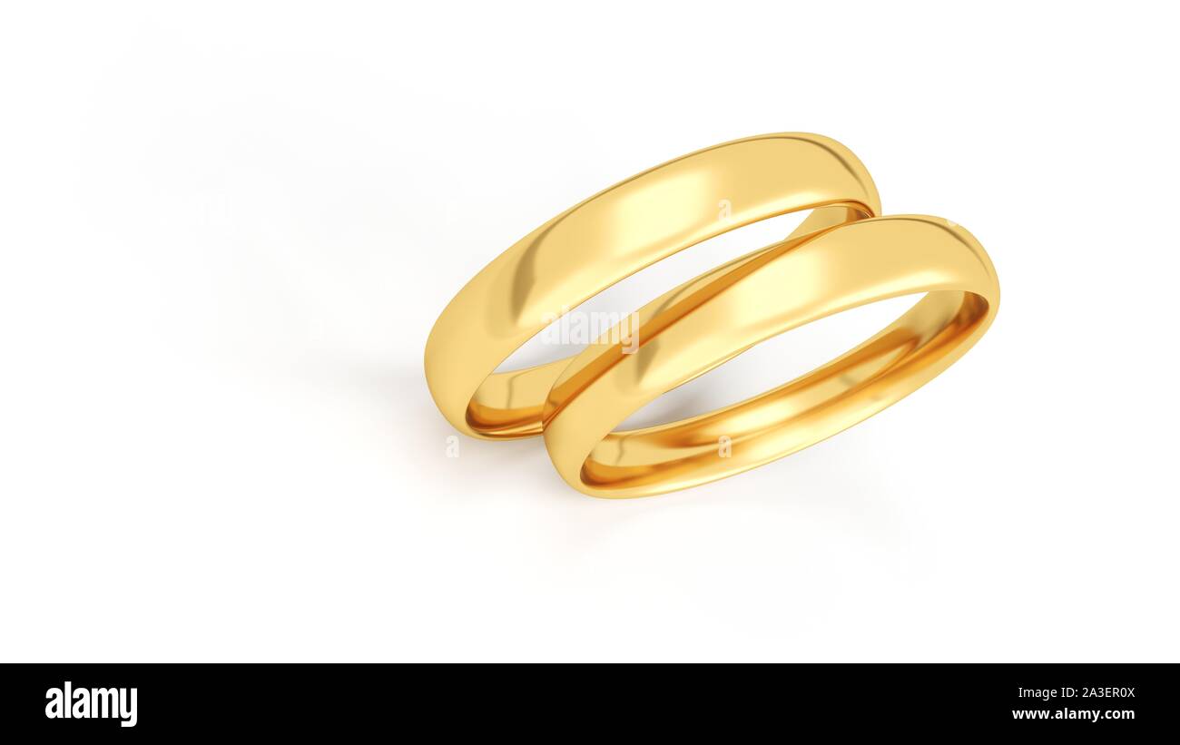 Anneaux de mariage d'or isolé sur fond blanc. Banque D'Images