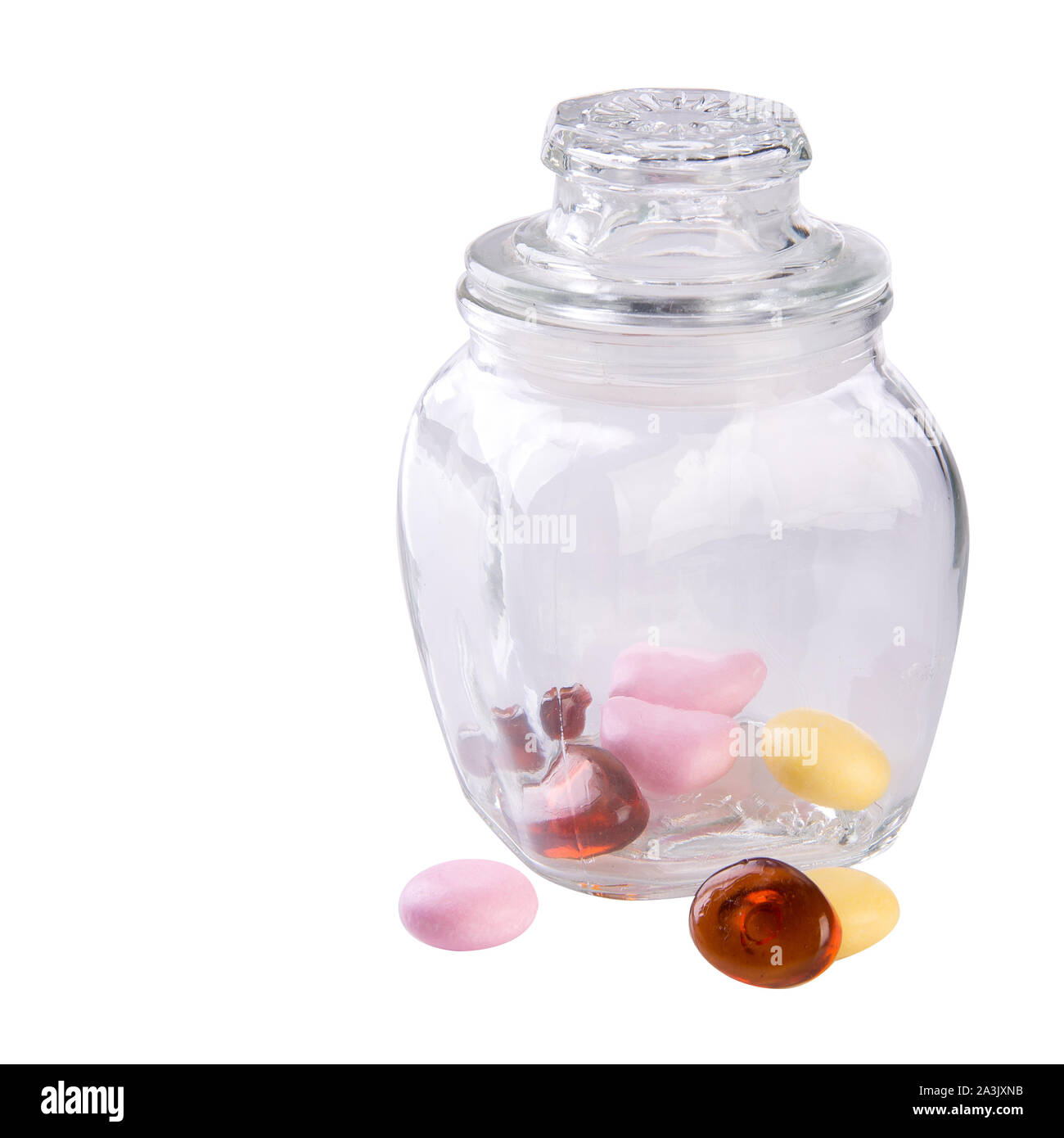 Bonbons bonbons colorés ou dans un bocal en verre sur l'arrière-plan Banque D'Images