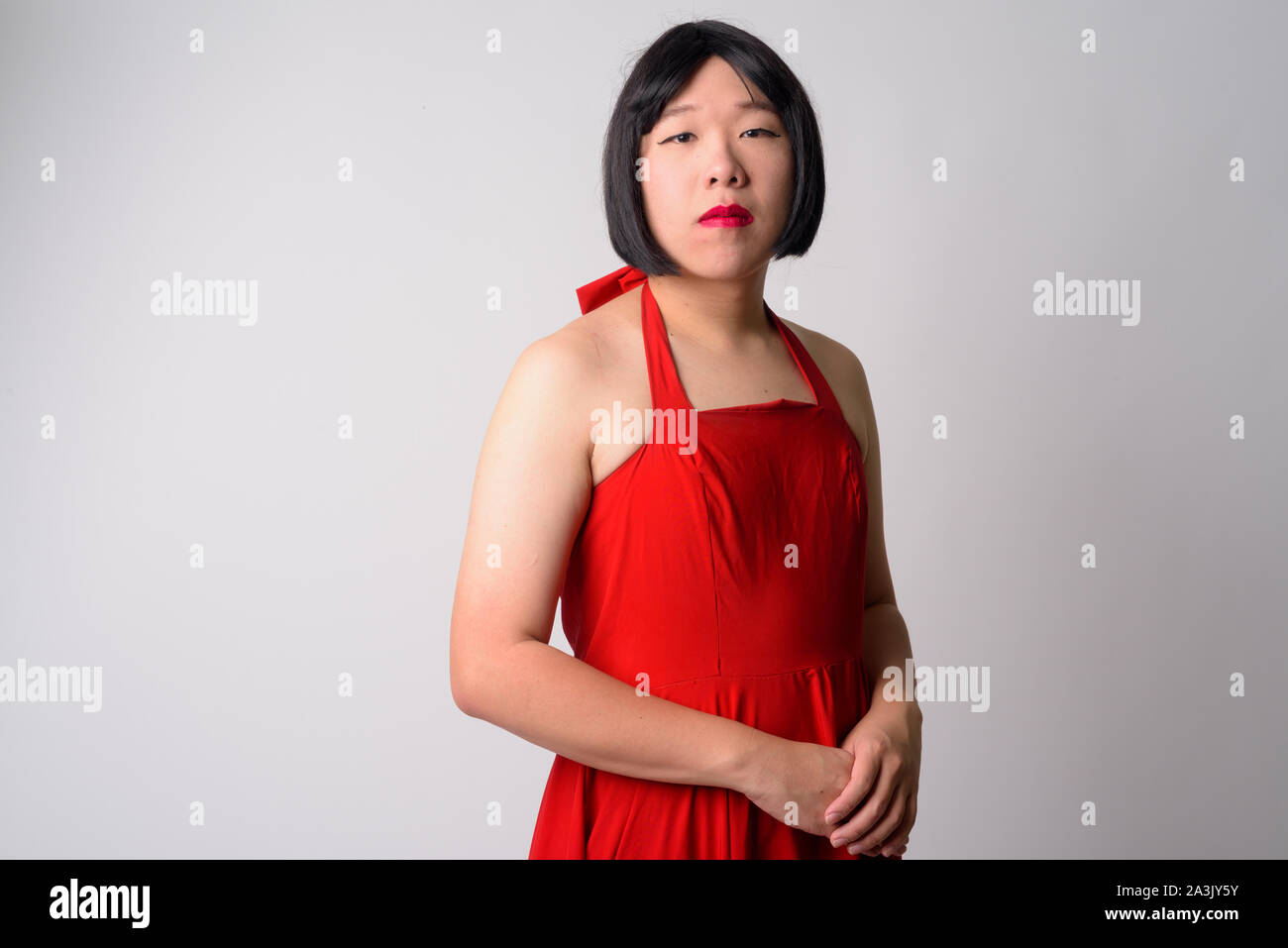 Portrait of young gay Asian man looking at camera Banque D'Images