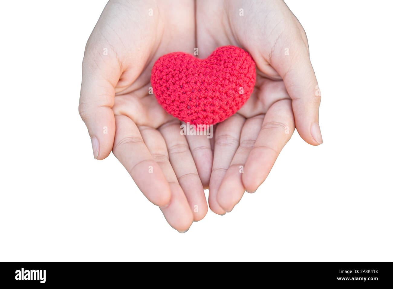 Coeur sur la main pour donner le partage et la charité isolé sur fond blanc avec chemin de détourage. Banque D'Images