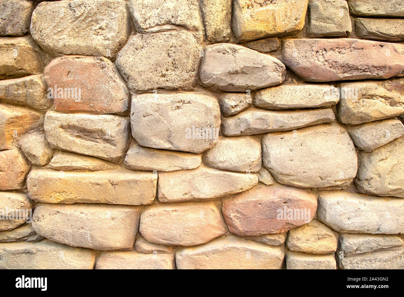 Mur en pierres naturelles massives de lumière. Fond Beige pour papiers peints. Banque D'Images