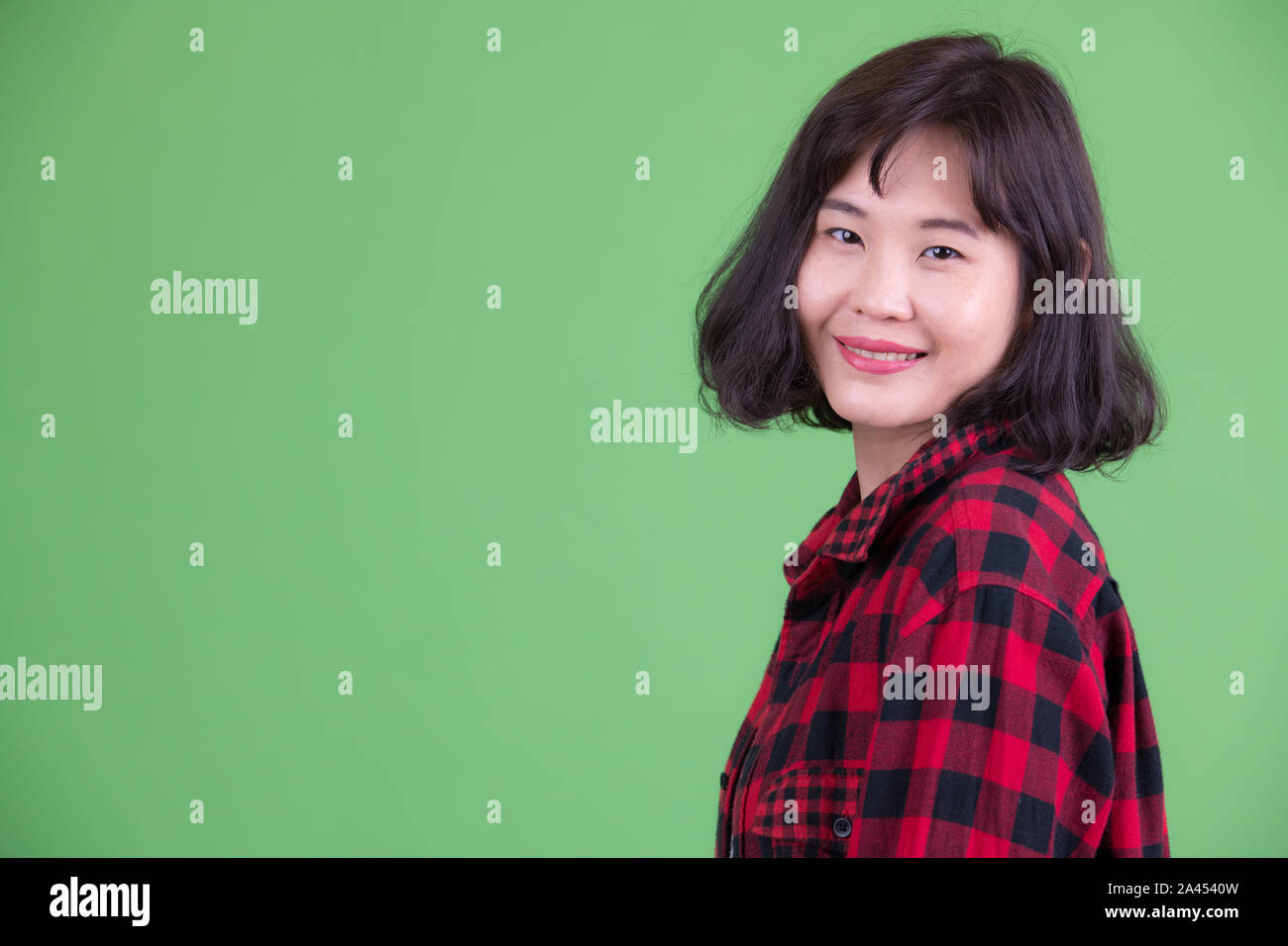 Le profil Voir les gros plan de happy Asian hipster woman looking at camera Banque D'Images