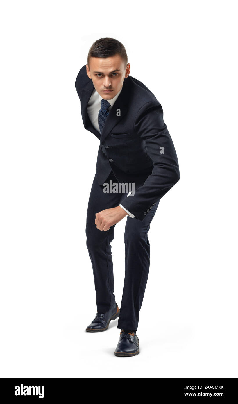Businessman dans la posture de préparation avant le début isolé sur fond blanc. Banque D'Images