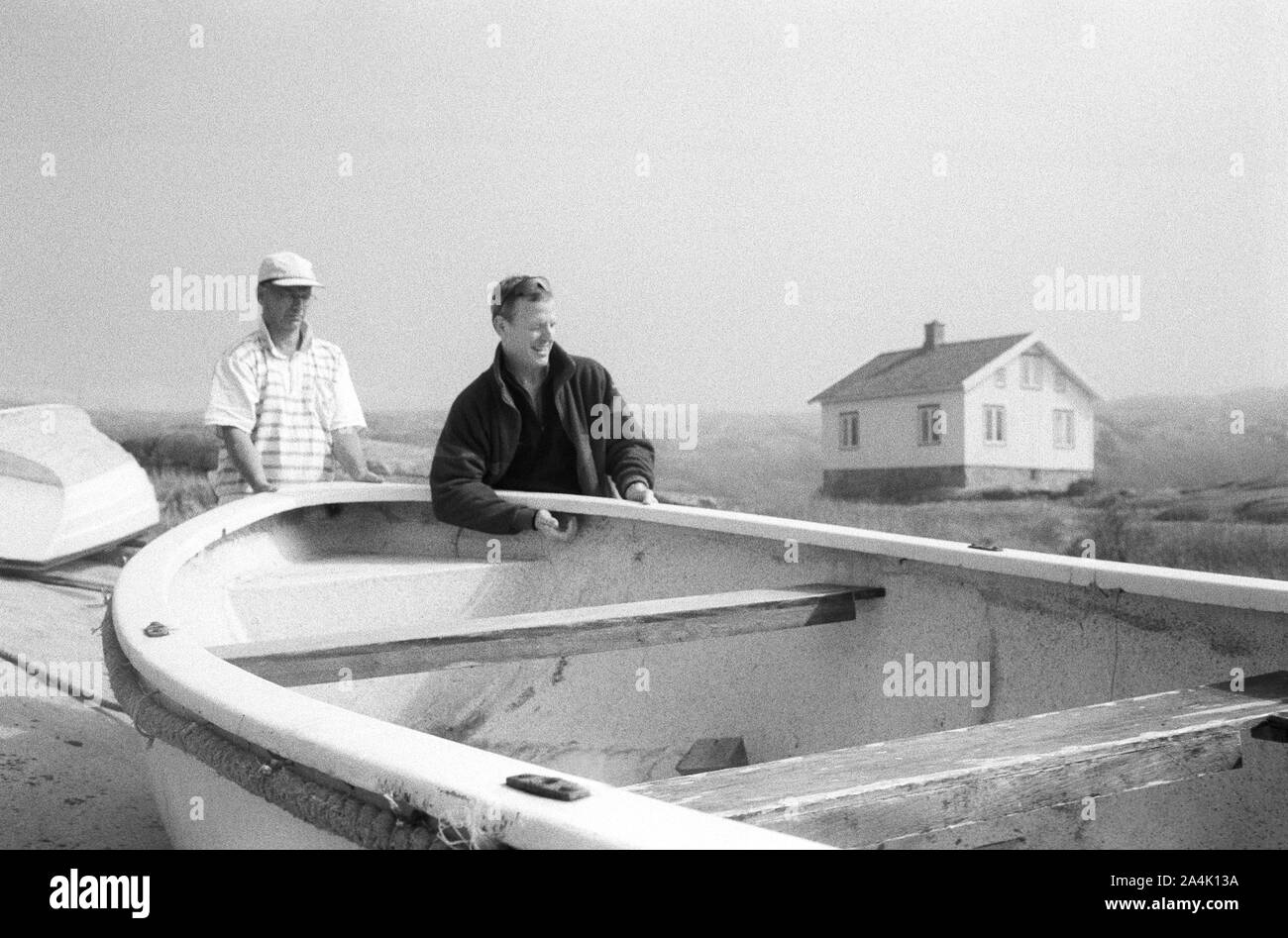 Les hommes et barque Banque D'Images