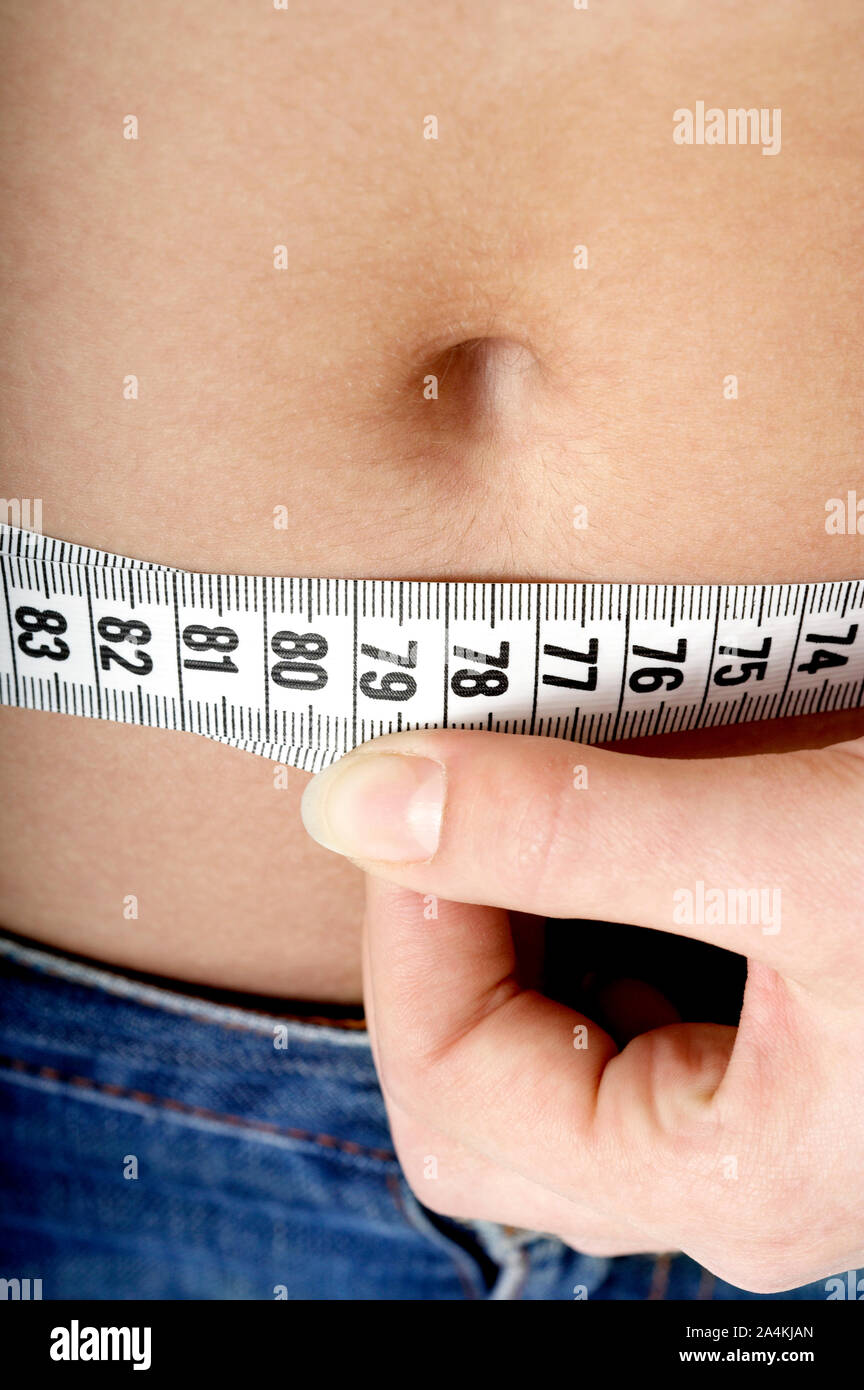 Measuring her waist Banque D'Images