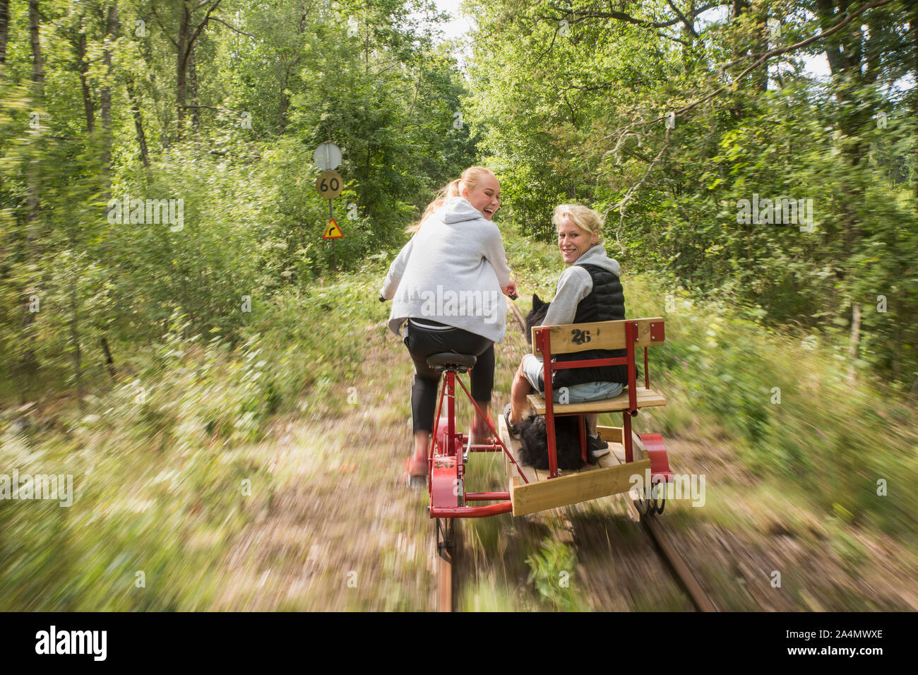 Teenage Girls using handcar Banque D'Images