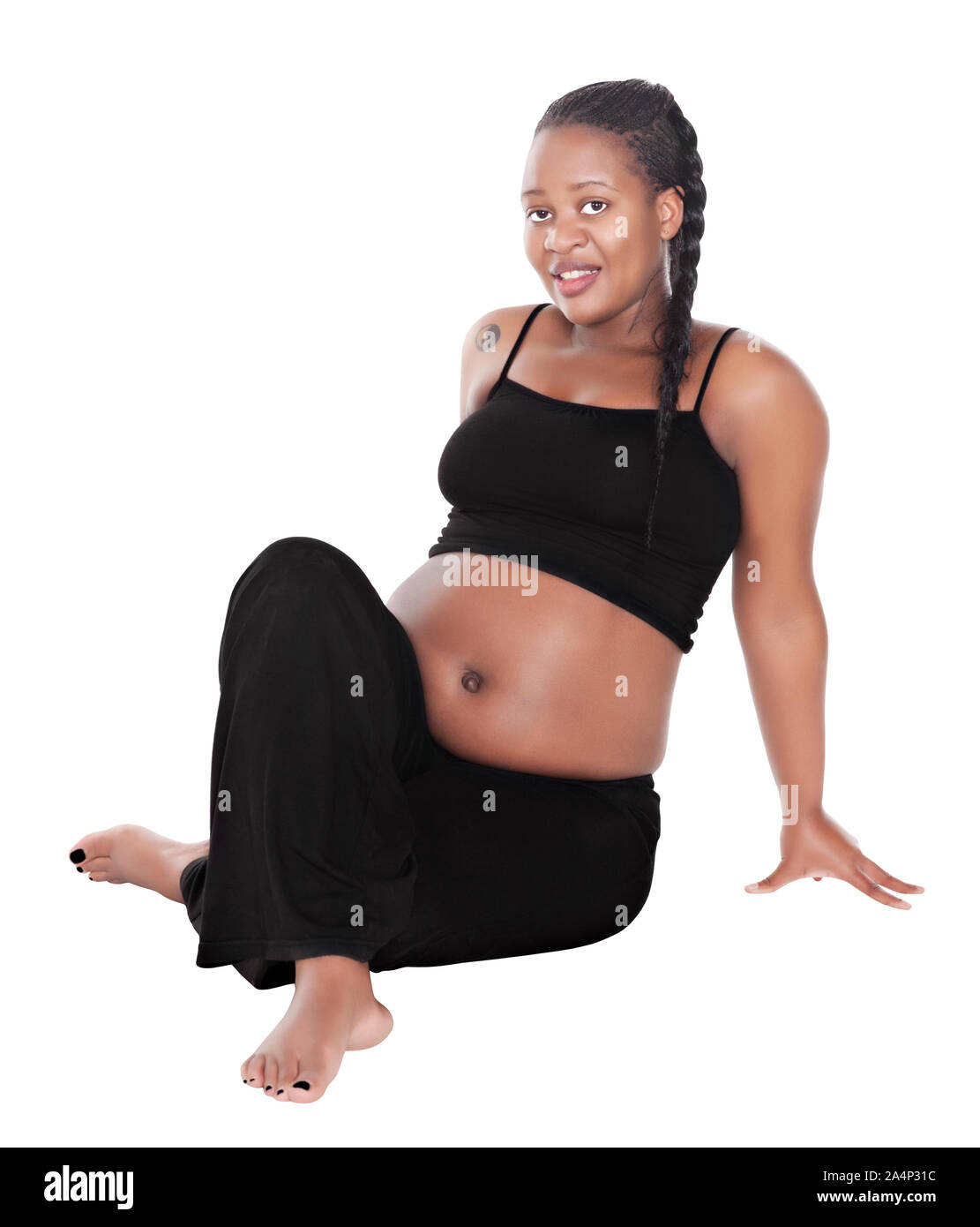 Femme africaine de faire des exercices de yoga femmes enceintes en bonne santé, vêtu de blanc et noir, isolated on white Banque D'Images